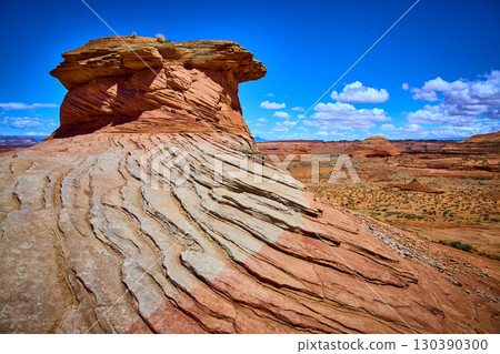Layered Red Sandstone Formation in Arizona Desert Under Blue Sky Layered Red Sandstone Formation in Arizona Desert Under Blue Sky 130390300