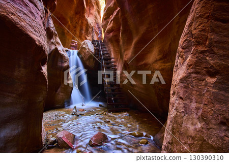 Waterfall Flow and Metal Ladder in Kanarra Creek Slot Canyon Low Eye Level Waterfall Flow and Metal Ladder in Kanarra Creek Slot Canyon Low Eye Level 130390310