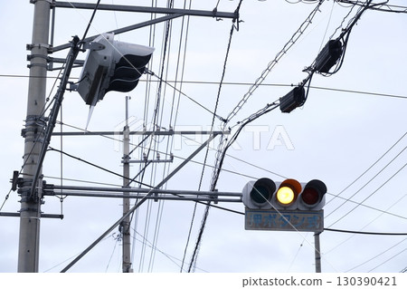 Push-button traffic light showing yellow light 130390421