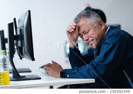 A tired-looking manager 130392349