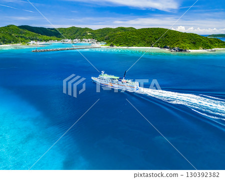 Drone shot of Agena Shiki Island. A large ferry enters Zamami Port. Zamami Island, Kerama Islands, Shimajiri District, Okinawa Prefecture - 2025 130392382