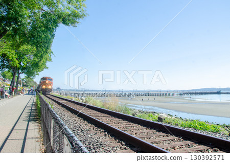 A train passing along the promenade at White Rock, Surrey, BC, Canada A train passing along the promenade at White Rock, Surrey, BC, Canada 130392571