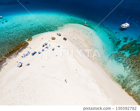 Drone footage of Kabi Island. Skin diving on a catamaran. Zamami Island, Kerama Islands, Shimajiri District, Okinawa Prefecture 130392782