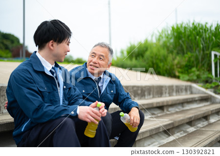 A scene of engineers taking a break while working on-site 130392821