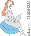 Woman sitting on a couch and using a computer 130394220