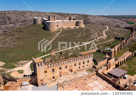 Berlanga de Duero medieval castle ruin near Soria, in the Castilla Leon region Spain with blue sky from air 130394365