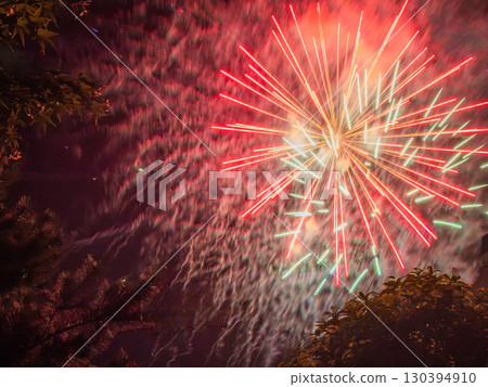A nostalgic summer, watching fireworks at a shrine while sitting in the schoolyard. Traditional Fireworks A nostalgic summer, watching fireworks at a shrine while sitting in the schoolyard. Traditional Fireworks 130394910