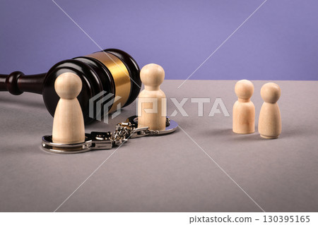 Parental rights termination concept with gavel, handcuffs and family figures 130395165