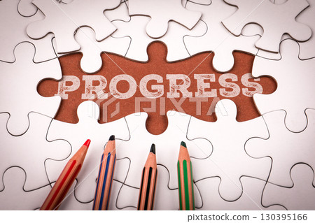 Creative progress concept with puzzle and colored pencils on white background Creative progress concept with puzzle and colored pencils on white background 130395166