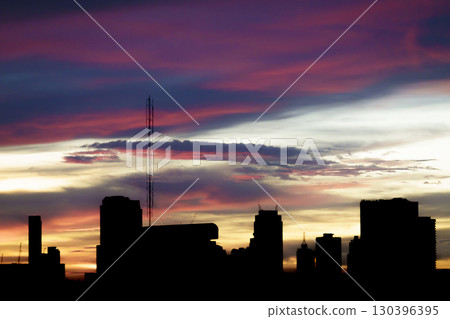 Beautiful sunset sky in Twilight time and silhouette of the city Beautiful sunset sky in Twilight time and silhouette of the city 130396395