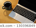 computer and coffee on the table 130396849