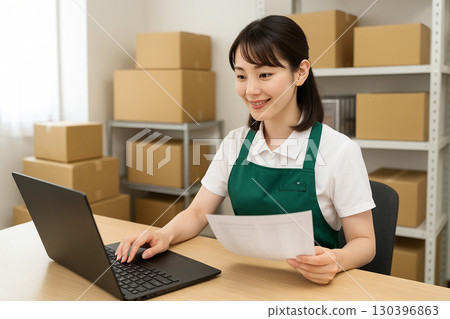 A woman working in a warehouse 130396863