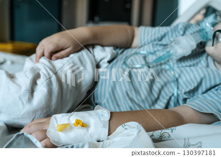 Child Patient Lying in Hospital Therapy Room 130397181