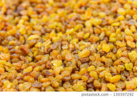 Close up of lots of golden raisins. Dried seedless grapes 130397292
