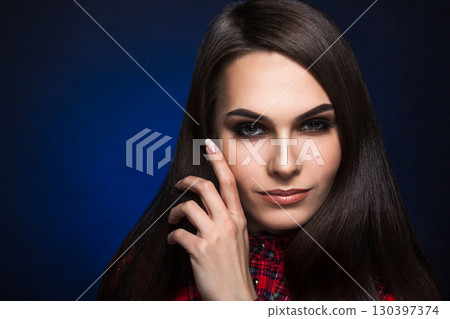 portrait of a beautiful girl in a shirt 130397374