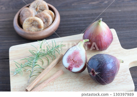 Figs on a cutting board with dried figs Figs on a cutting board with dried figs 130397989