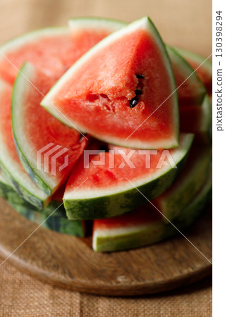 Slices of fresh watermelon on rustic wooden background. Slices of fresh watermelon on rustic wooden background. 130398294