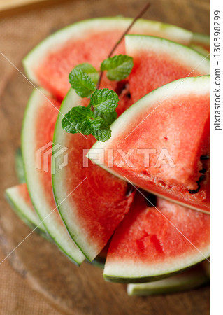 Slices of fresh watermelon on rustic wooden background. Slices of fresh watermelon on rustic wooden background. 130398299