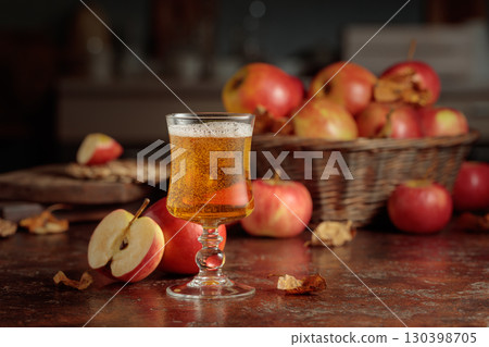 Apple cider on an old kitchen table. 130398705