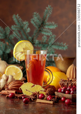 Hot Christmas drink with spices. 130398712