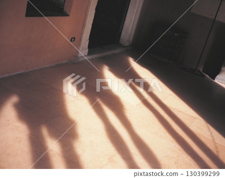 Old street in Rome Shadow of a capital reflected on the floor 130399299