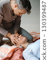 Relaxing massage therapy session focusing on facial techniques in a serene indoor setting during daylight hours 130399487