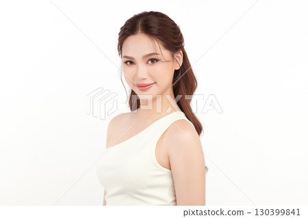 A beautiful young Asian woman with clean, fresh skin against a white background. Skincare, facial treatment, cosmetology, beauty, and spa. An elegant portrait of an Asian woman. A beautiful young Asian woman with clean, fresh skin against a white background. Skincare, facial treatment, cosmetology, beauty, and spa. An elegant portrait of an Asian woman. 130399841