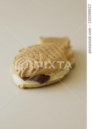 Taiyaki with bean paste spilling out Taiyaki with bean paste spilling out 130399917