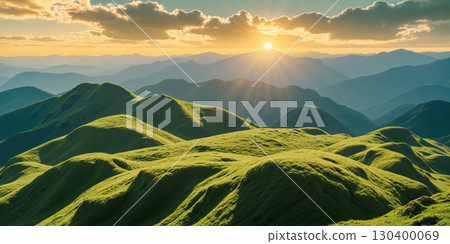 Green hills in the morning with the sun rising on the horizon 130400069