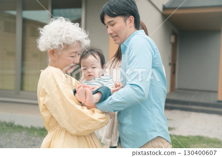 Letting parents hold their grandchildren 130400607