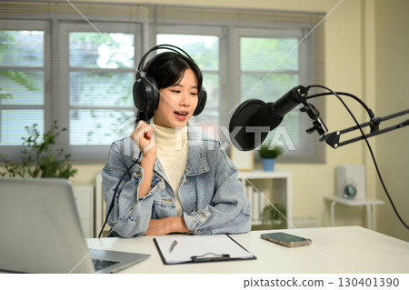 Content creator recording an audio session or live streaming at home Content creator recording an audio session or live streaming at home 130401390