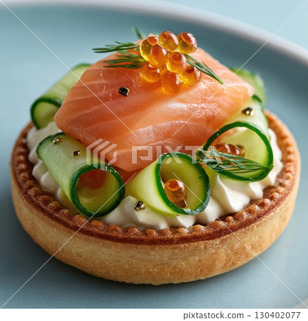 Smoked Trout Mousse on Crisp Seaweed Cracker Topped with Pickled Cucumber Ribbons and Dill Garnish 130402077