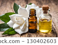 Fresh gardenia flowers and their oil, used in folk medicine to treat colds and lung problems, showcasing their therapeutic and natural medicinal properties for wellness. AI Generated 130402603