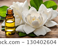 Fresh gardenia flowers and oil, prized as cosmetic ingredients used in spa treatments for their sweet, relaxing fragrance and skin nourishing properties. AI Generated 130402604