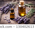Fresh lavender sprigs and essential oil with medicinal properties, known for their relaxing aroma, stress relief and benefits for sleep, skin, and pain. AI Generated 130402613