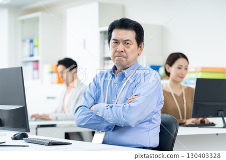 Senior businessman working in the office Senior businessman working in the office 130403328