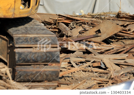 Image of piles of rubble at a demolition site 130403334