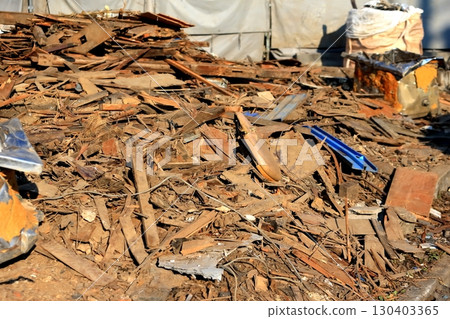 Image of piles of rubble at a demolition site 130403365