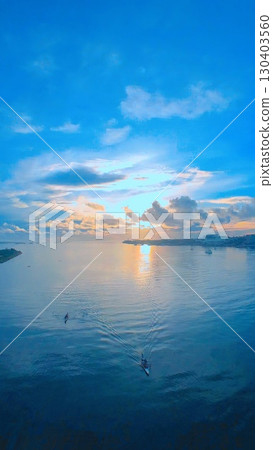 A boat floating in the sea 130403560