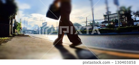 A person walking majestically to work 130403858