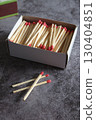 Open wooden matchbox on a dark background 130404851