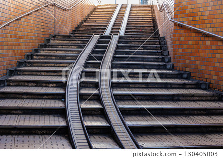 Underground tunnel stairs with bicycle Pushing ramps track rail in developed country and people use bicycles 130405003