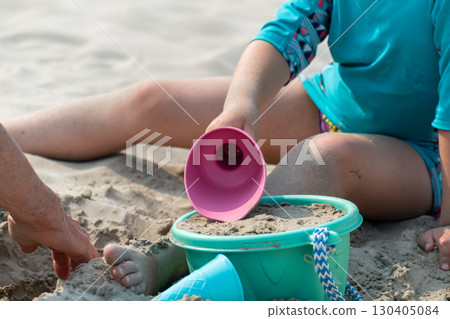 Child playing on a beach, good activity and sport for health and mental health Child playing on a beach, good activity and sport for health and mental health 130405084