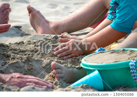 Child playing on a beach, good activity and sport for health and mental health Child playing on a beach, good activity and sport for health and mental health 130405086