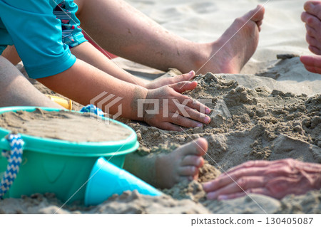 Child playing on a beach, good activity and sport for health and mental health Child playing on a beach, good activity and sport for health and mental health 130405087
