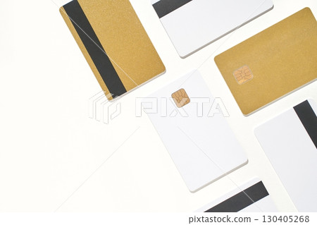 Arrangement of gold and white credit cards with chips and magnetic stripes Arrangement of gold and white credit cards with chips and magnetic stripes 130405268