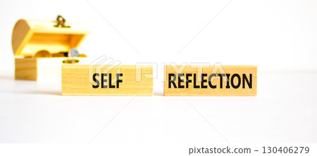 Self reflection symbol. Concept word Self reflection on wooden blocks. Beautiful white table white background. Wooden chest with coins. Business psychological and self reflection concept. Copy space. Self reflection symbol. Concept word Self reflection on wooden blocks. Beautiful white table white background. Wooden chest with coins. Business psychological and self reflection concept. Copy space. 130406279