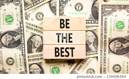 Motivational be the best symbol. Concept words Be the best on beautiful wooden blocks. Dollar bills. Beautiful background from dollar bills. Business motivational be the best concept. Copy space. 130406304