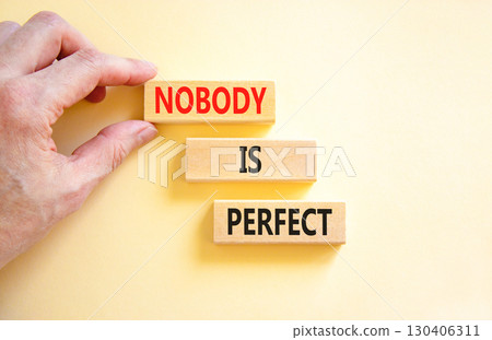 Nobody is perfect symbol. Concept words Nobody is perfect on beautiful wooden block. Beautiful white background. Business motivational lifestyle and nobody is perfect concept. Copy space. 130406311