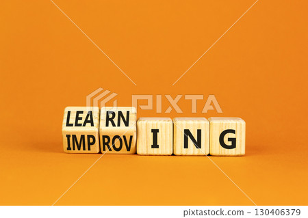 Doing or learning symbol. Turned wooden cubes and changed the word Doing to Learning . Beautiful orange table orange background. Educational business doing or learning concept. Copy space. 130406379